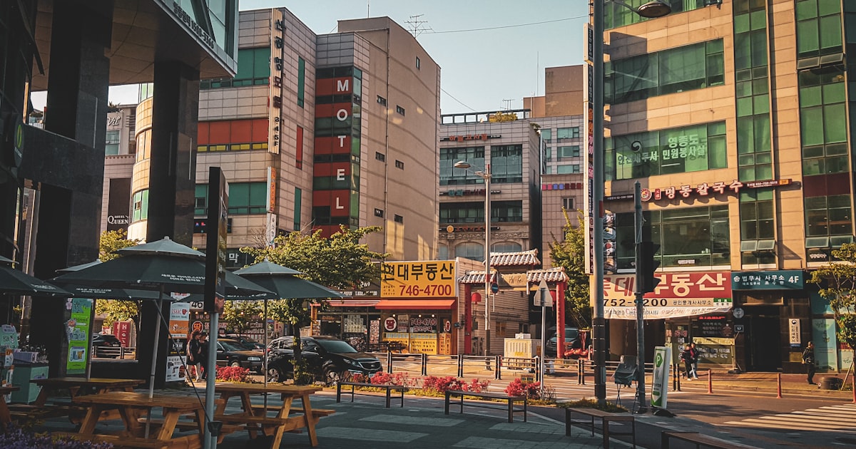 a city street with a lot of tall buildings