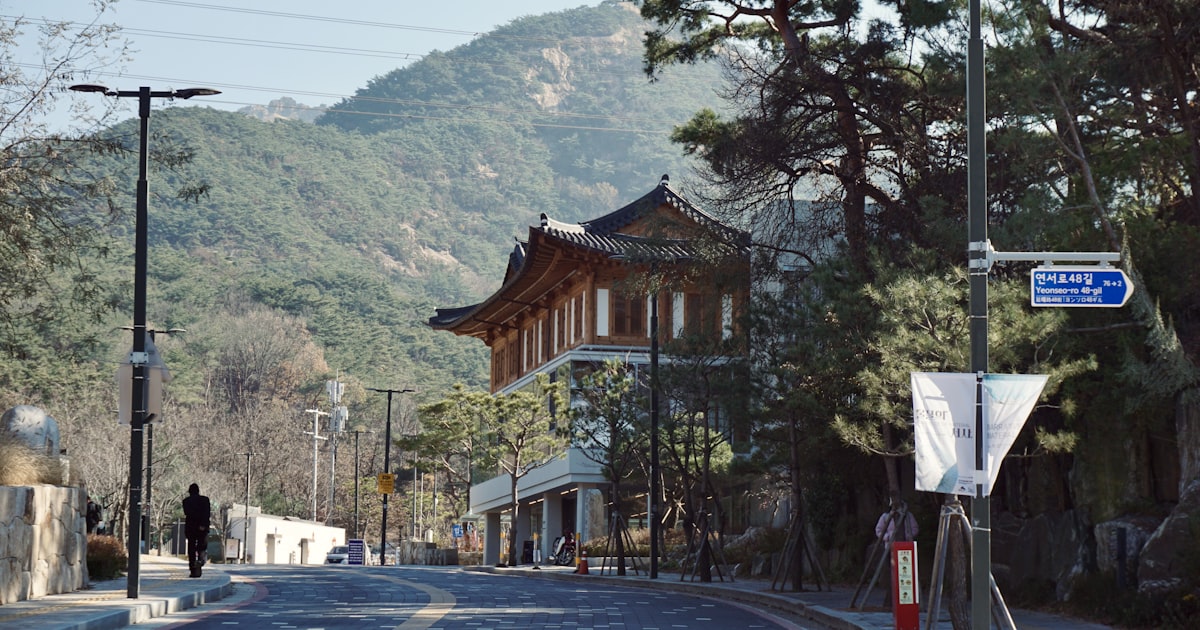 A street with a mountain in the background
