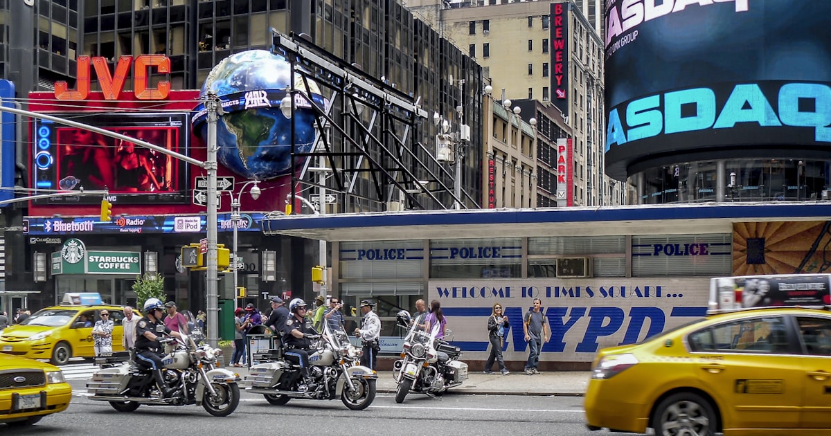 people riding motorcycle on road during daytime