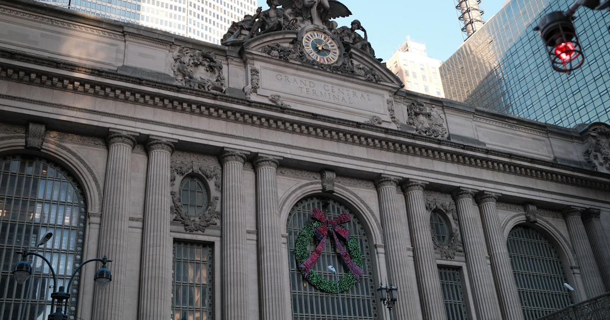 A large building with a clock on the front of it