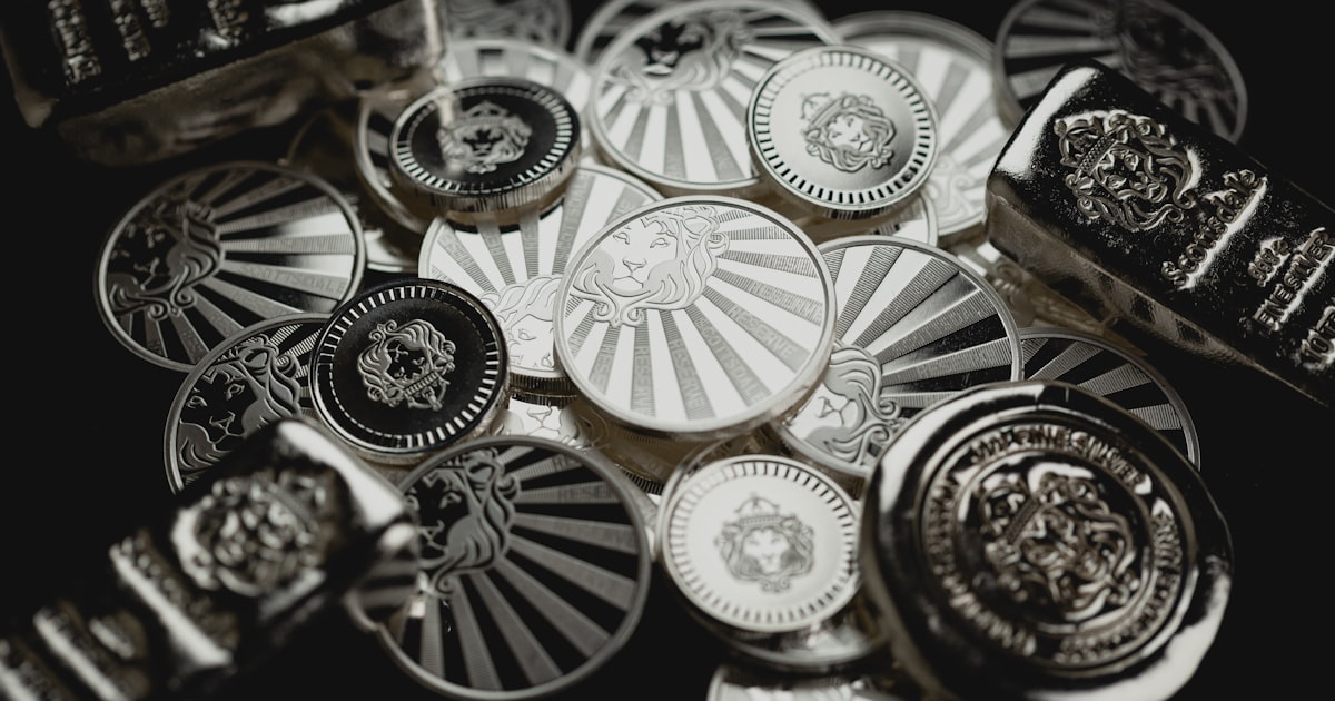 a bunch of metal buttons sitting on top of a table