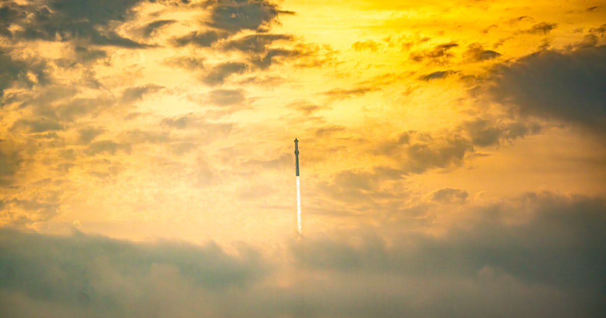 a plane flying through a cloudy sky at sunset