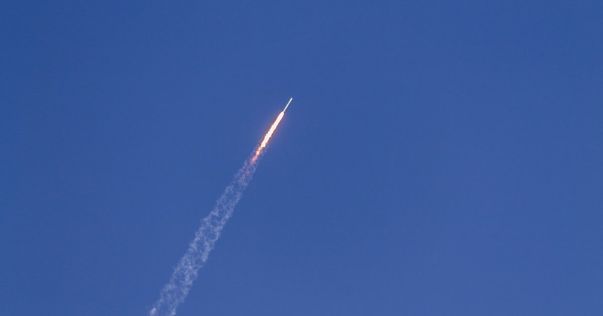 flying rocket during daytime