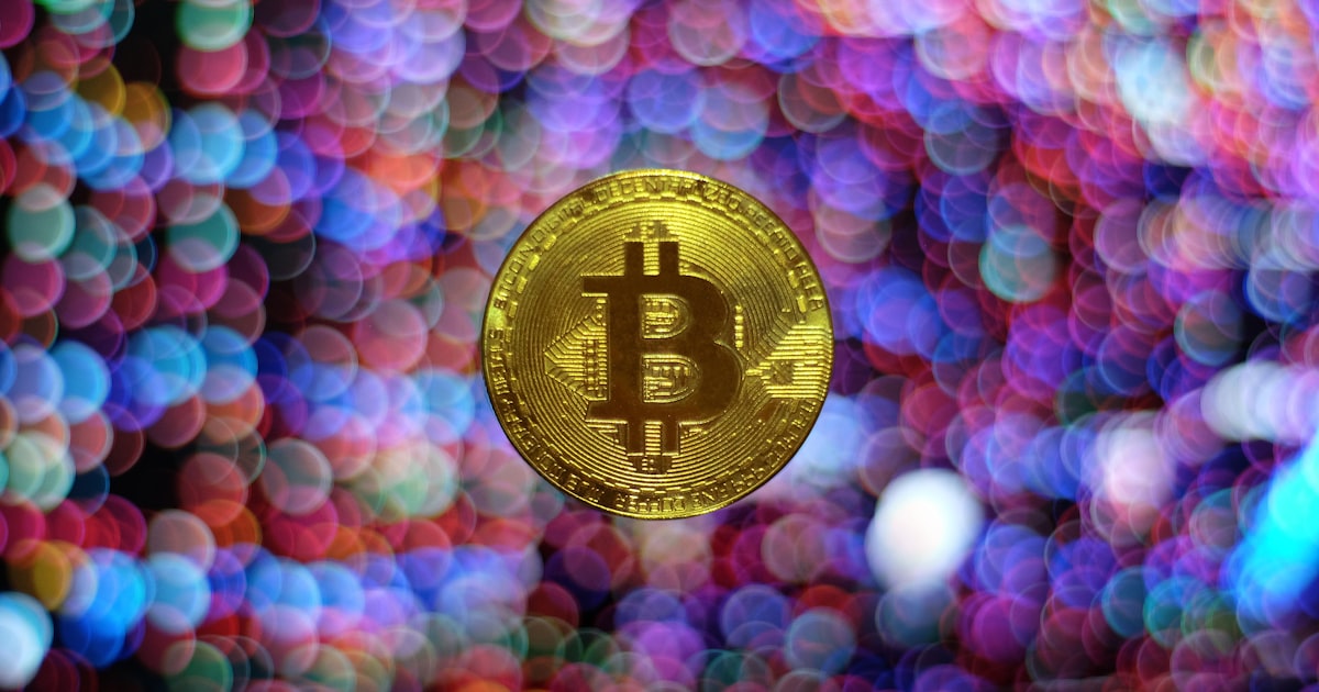 round gold-colored Bitcoin illustration