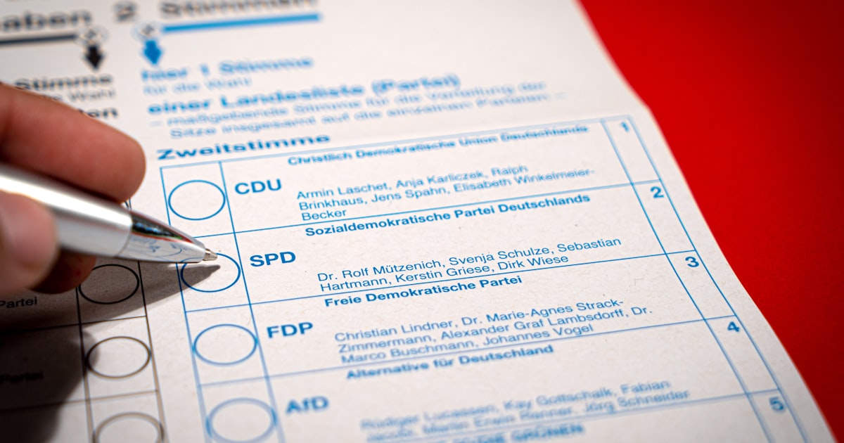 a person is filling out a form with a pen