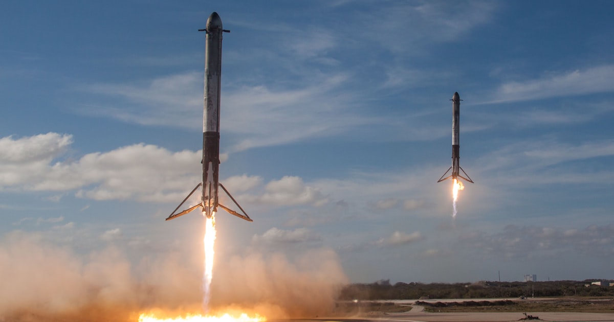 twom white flying rockets during daytime