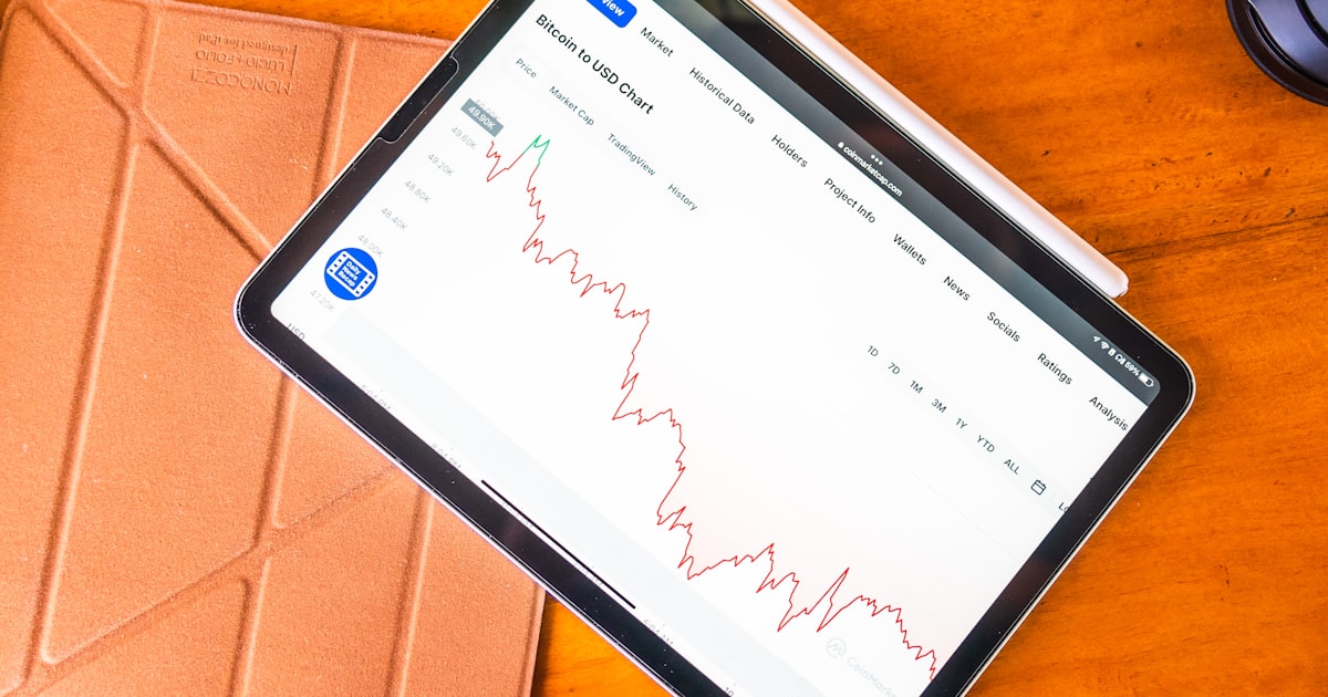 a tablet computer sitting on top of a wooden table
