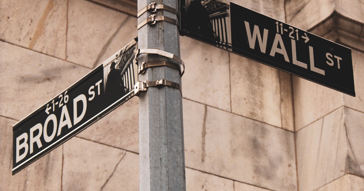 a couple of street signs on a metal pole