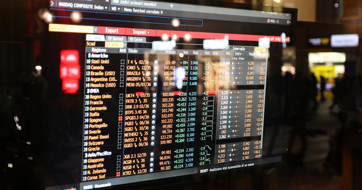Financial stock market data displayed on a screen.