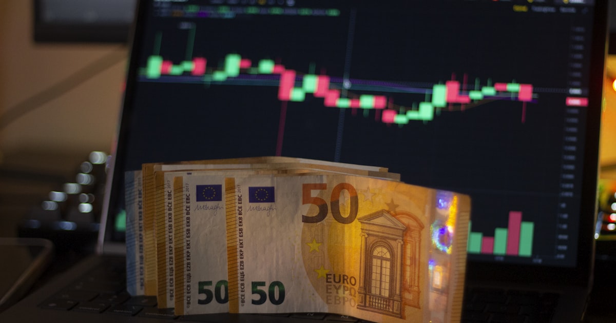 a laptop computer sitting on top of a desk