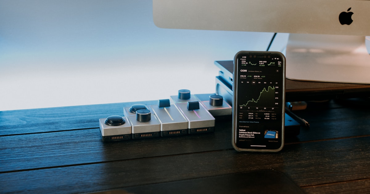 a remote control sitting next to a computer monitor