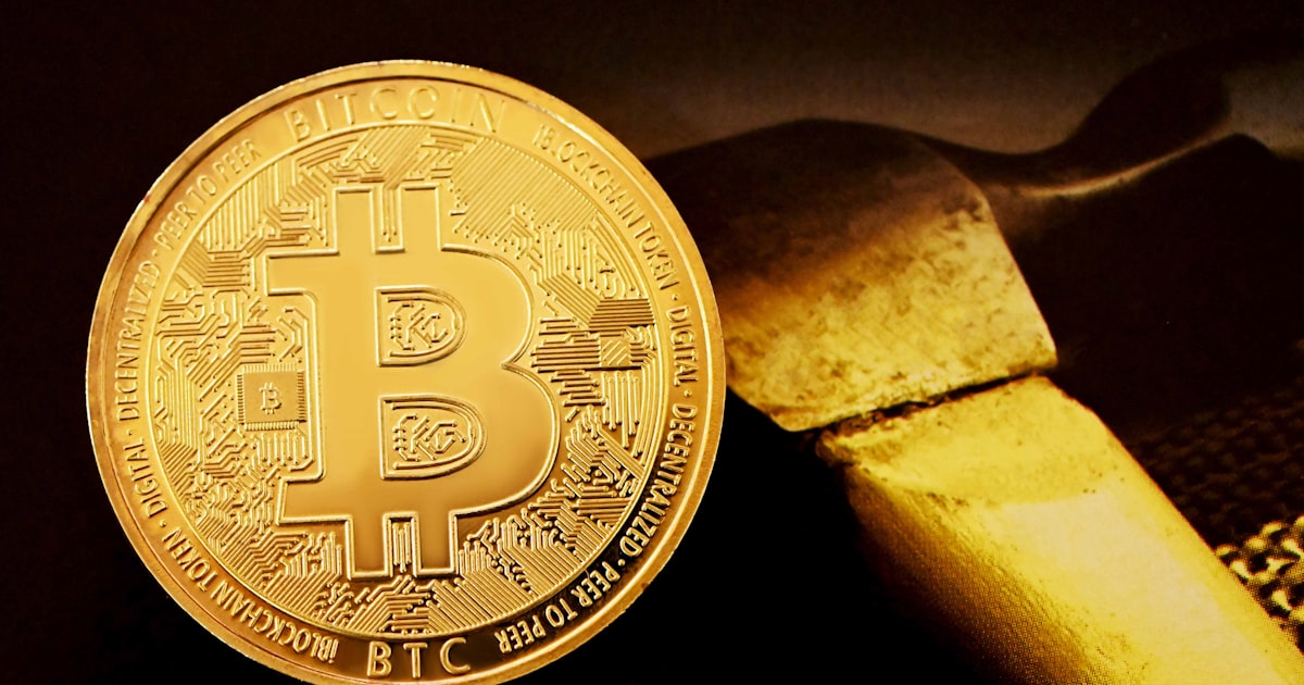gold round coin on black surface