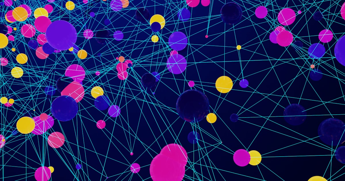 a large group of colorful balls floating in the air
