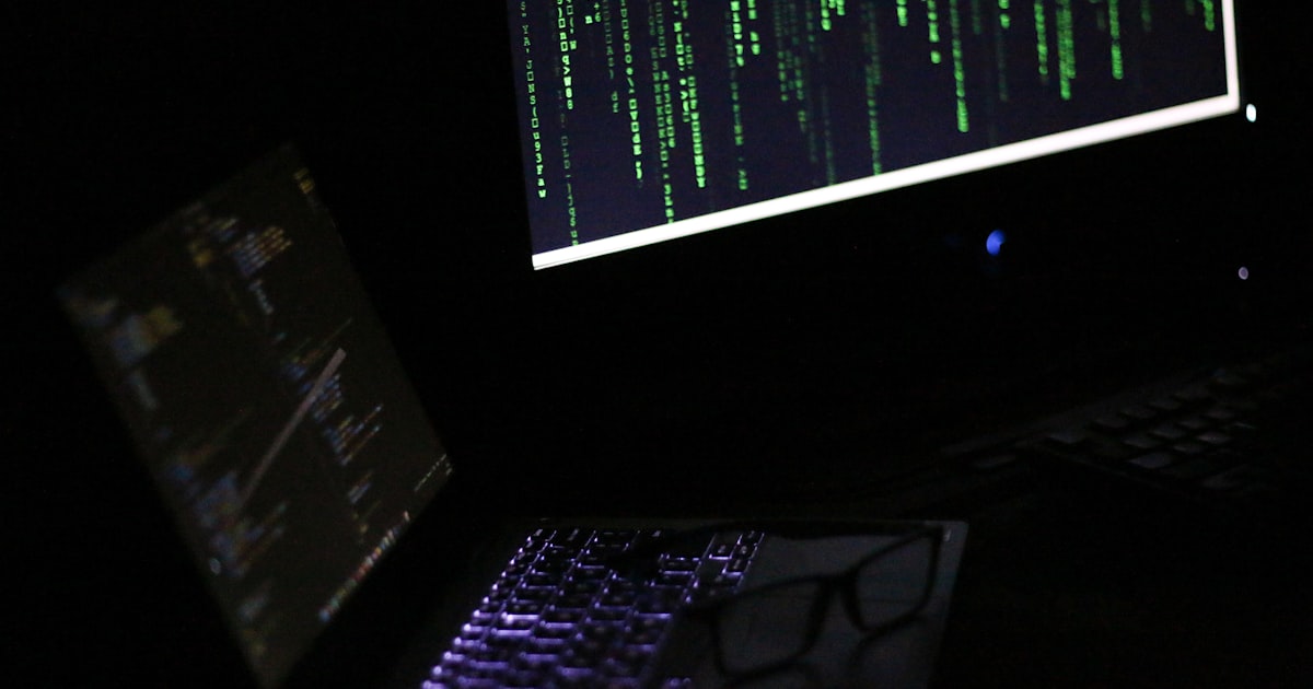 A laptop computer sitting on top of a desk