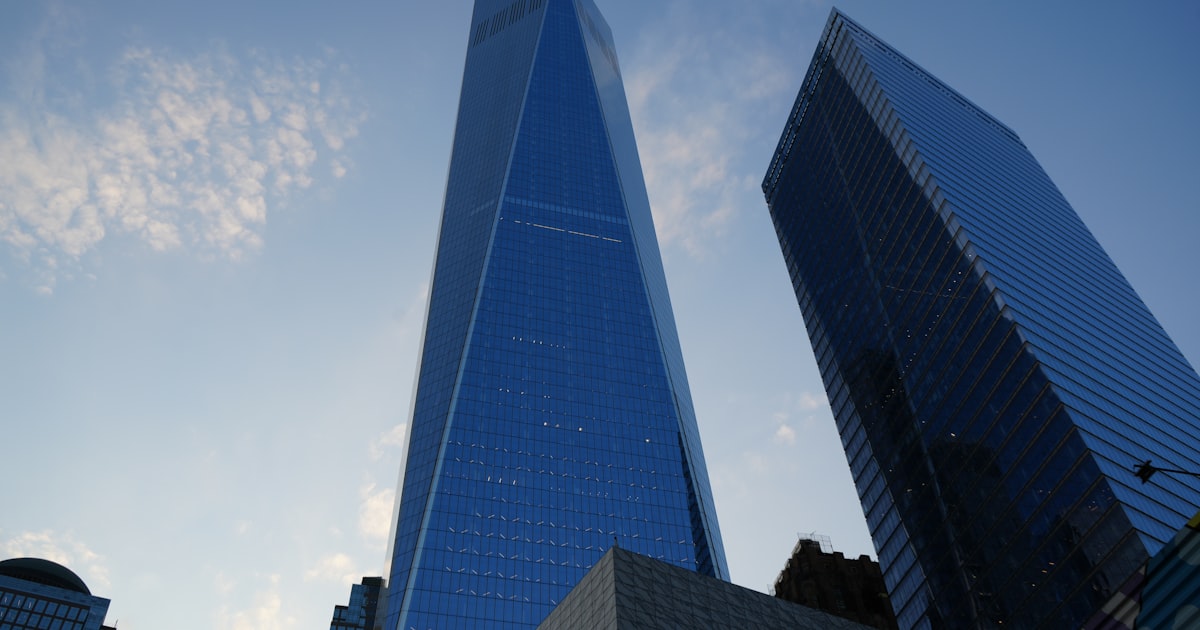 a very tall building towering over a city