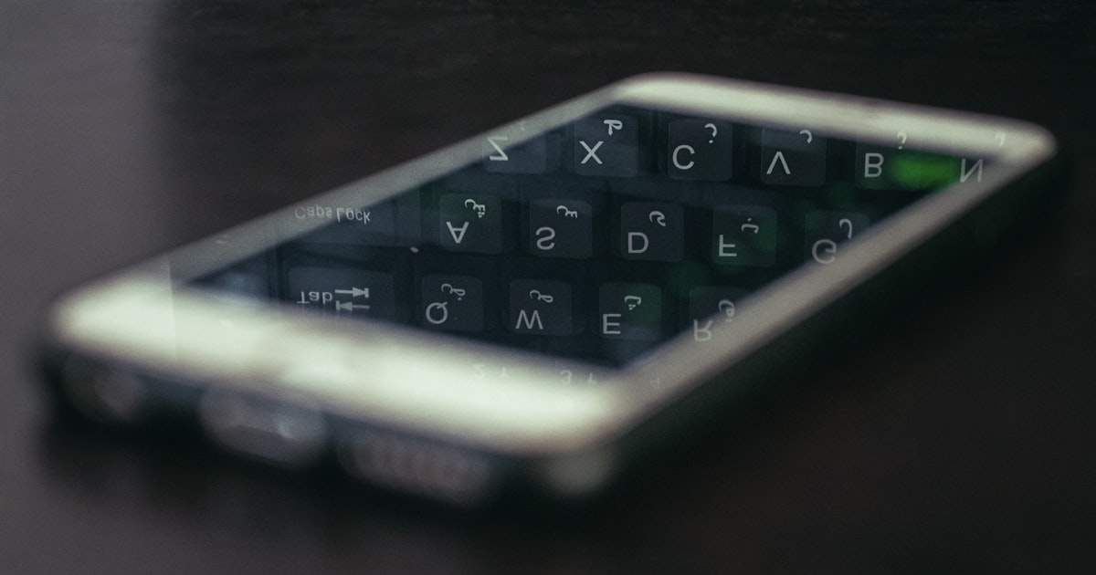 a close up of a cell phone on a table