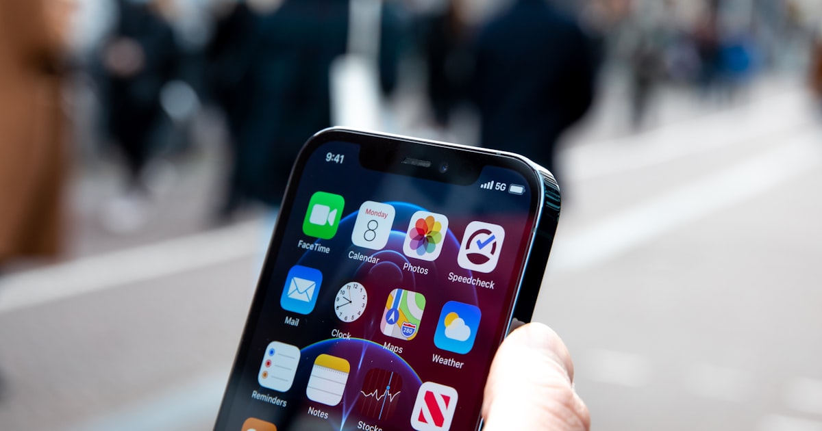 a person holding an iphone in their hand