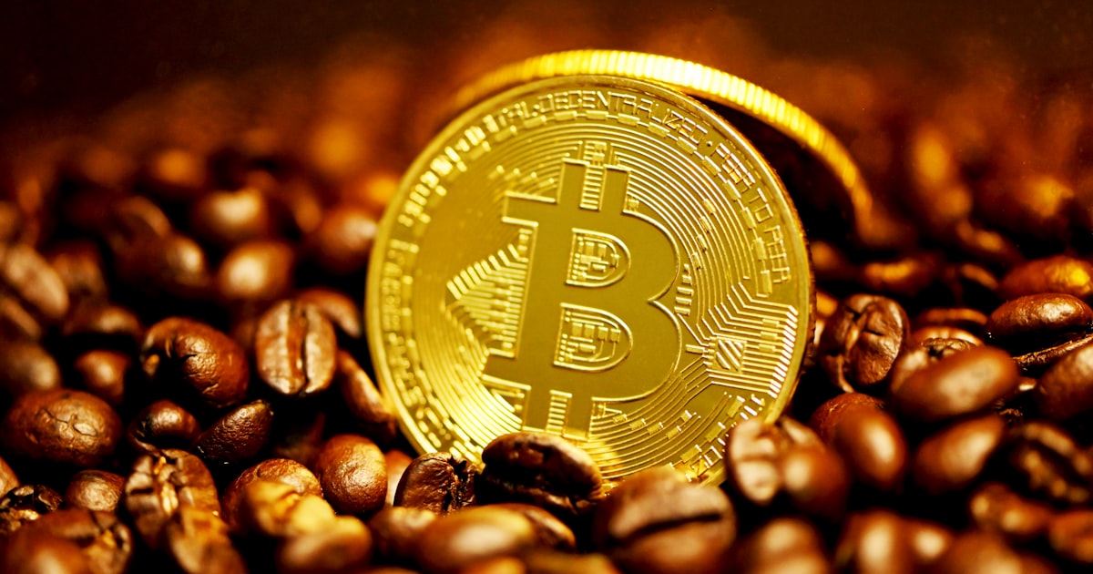 gold round coin on brown coffee beans