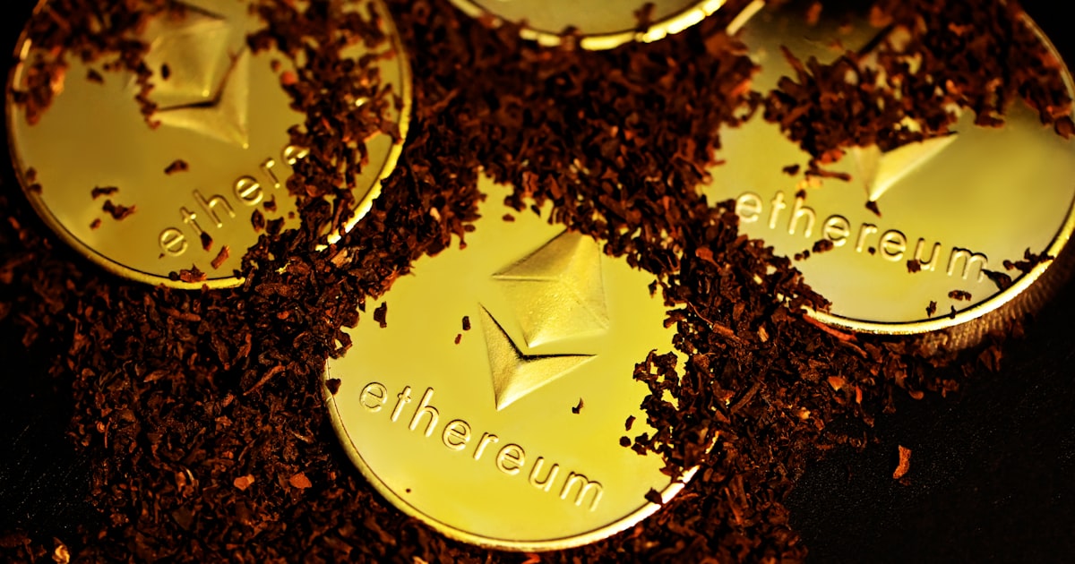a group of three gold coins sitting on top of a pile of dirt