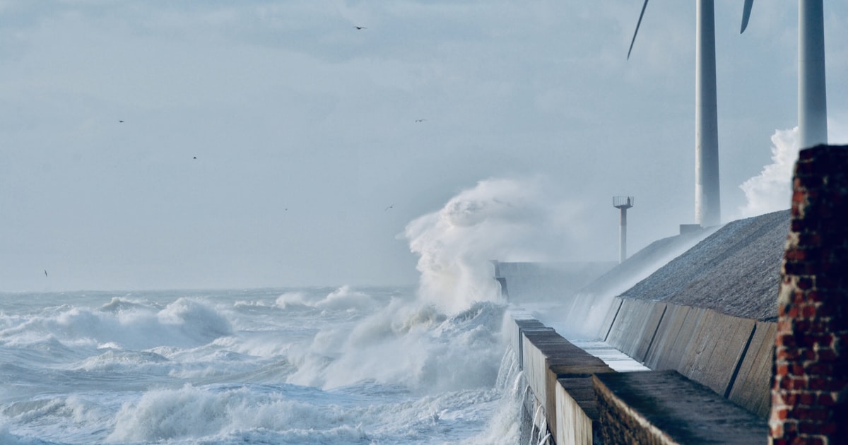 white wave sprays on dock