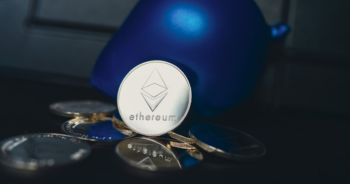 a blue ball sitting on top of a pile of coins