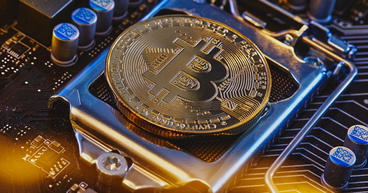 a bitcoin sitting on top of a computer motherboard