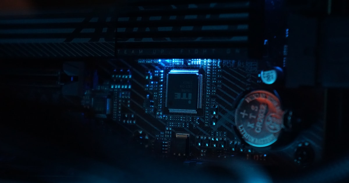 A close up of a computer motherboard in a dark room