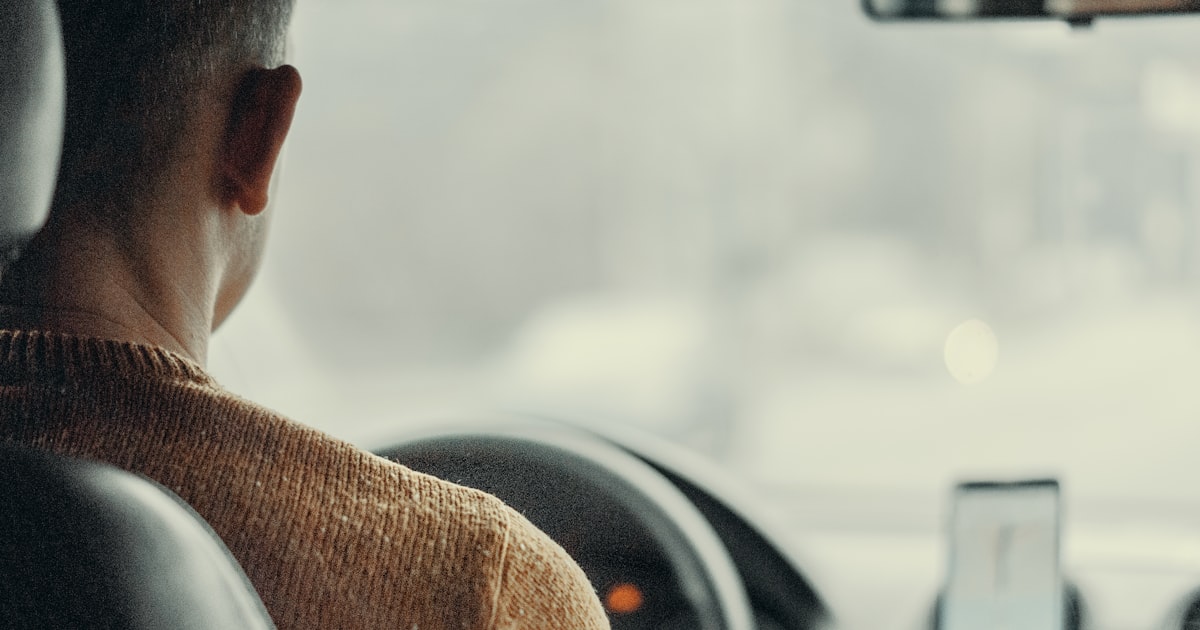 man driving vehicle
