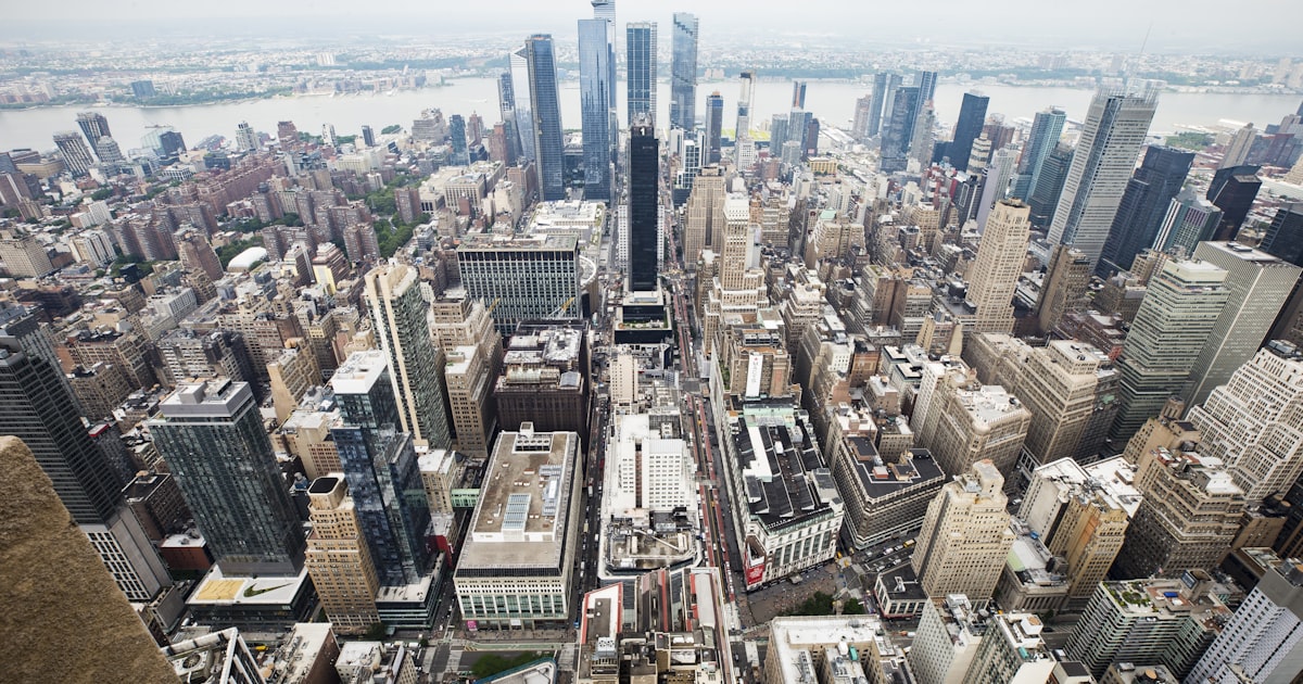 an aerial view of a city with tall buildings
