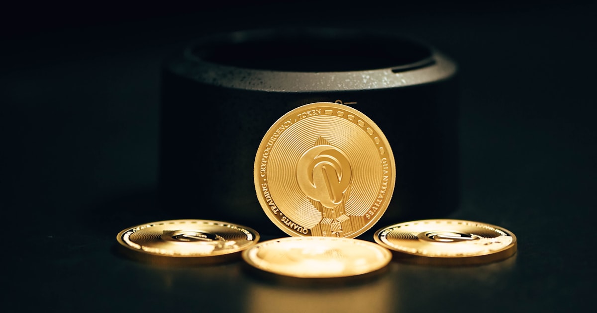 a gold coin sitting on top of a black table