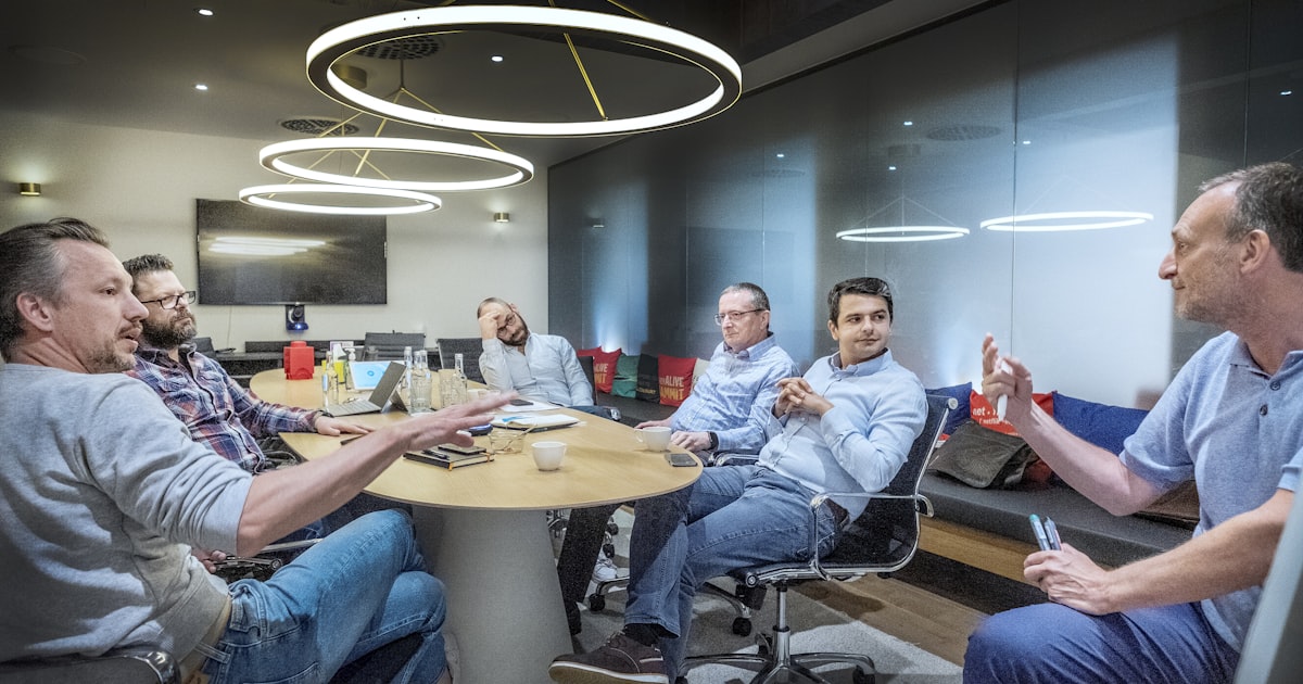 group of people sitting on chair