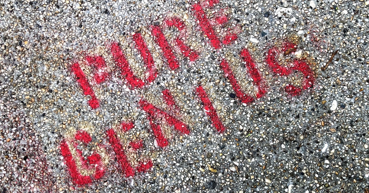 a close up of a street sign on the ground