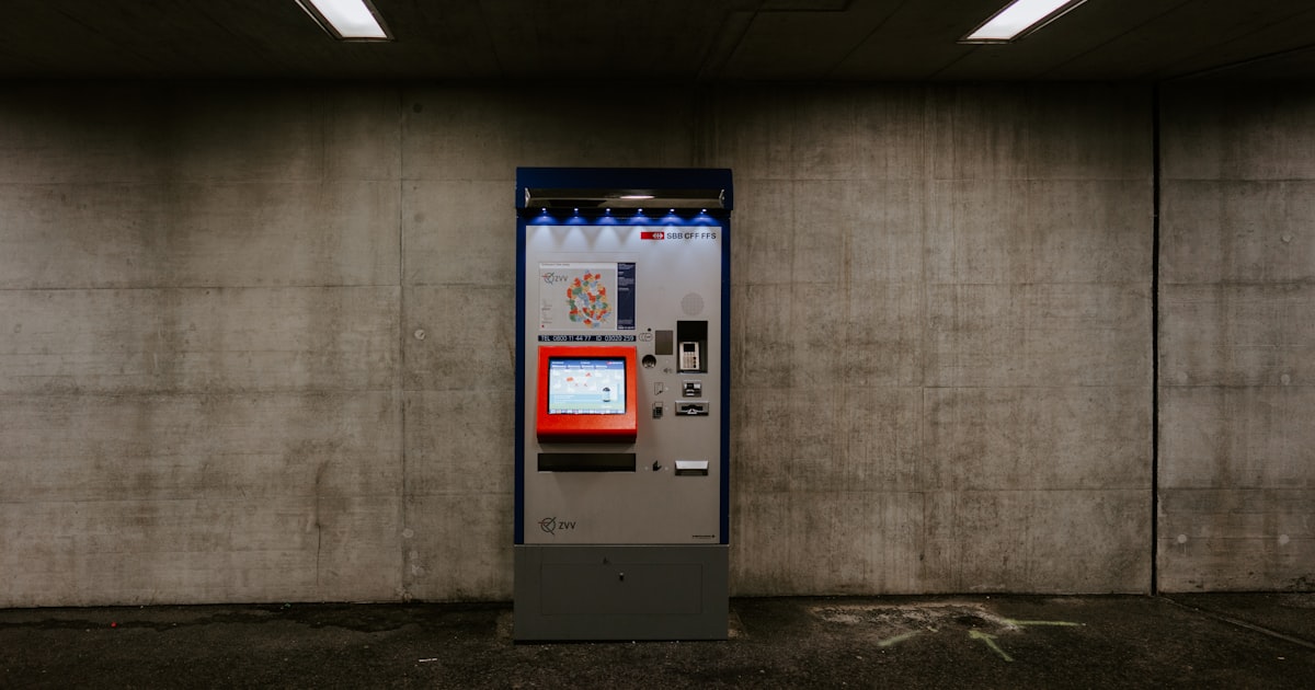 white and blue atm machine