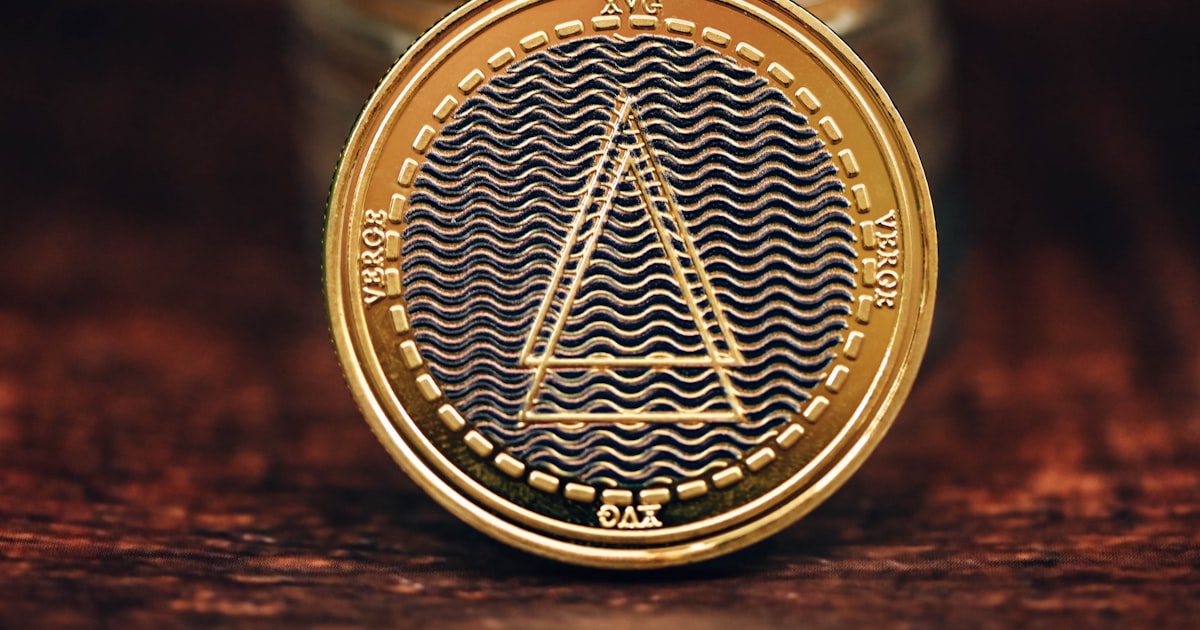 a gold coin sitting on top of a wooden table