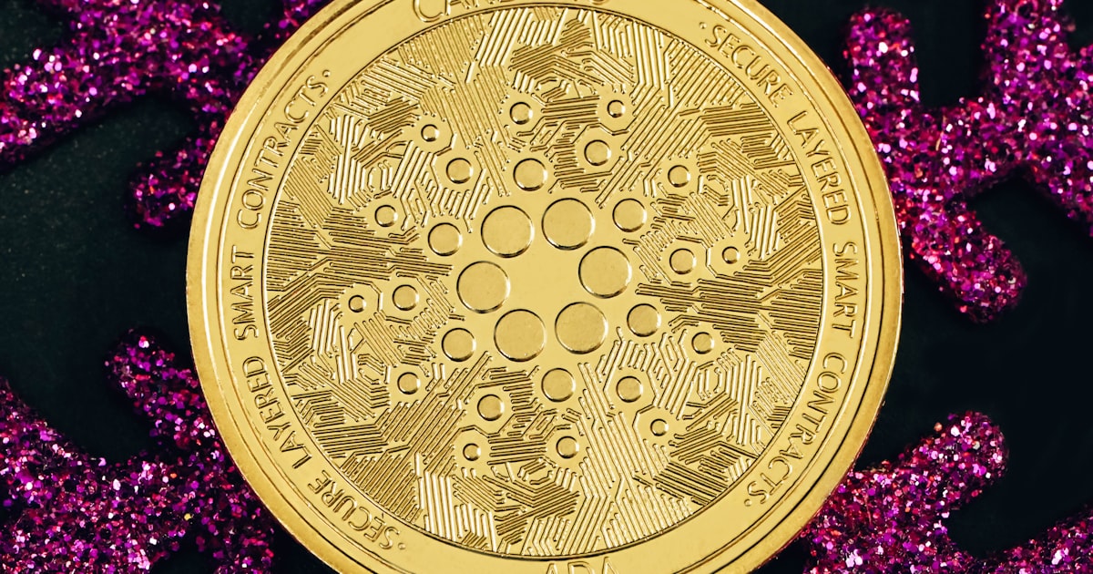 a gold coin sitting on top of purple glitter