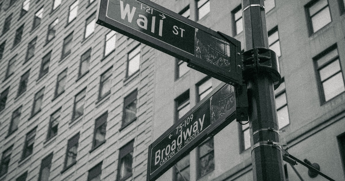 a black and white photo of a street sign