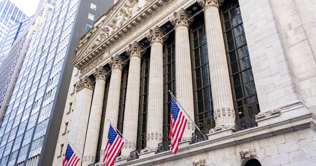 New york stock exchange building with american flags.