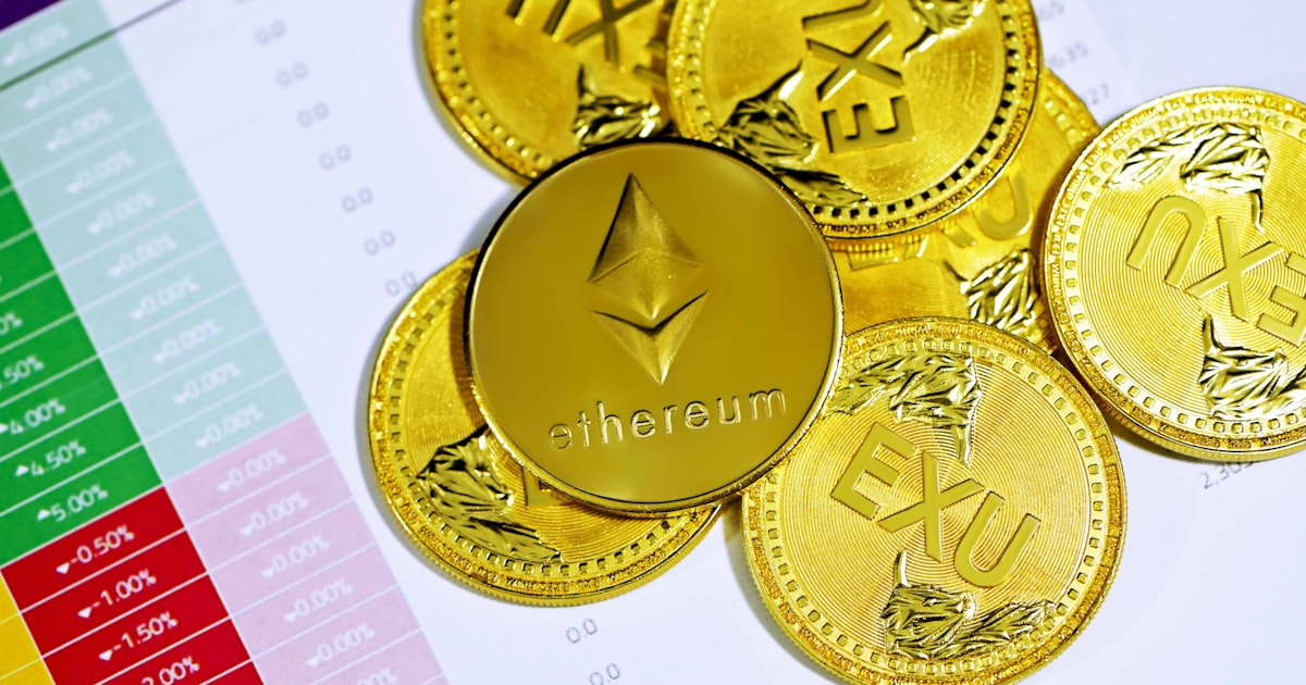 gold round coins on white paper