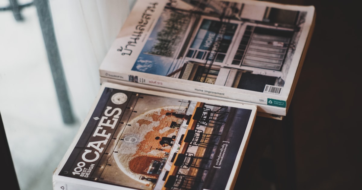 newspaper on white wooden shelf