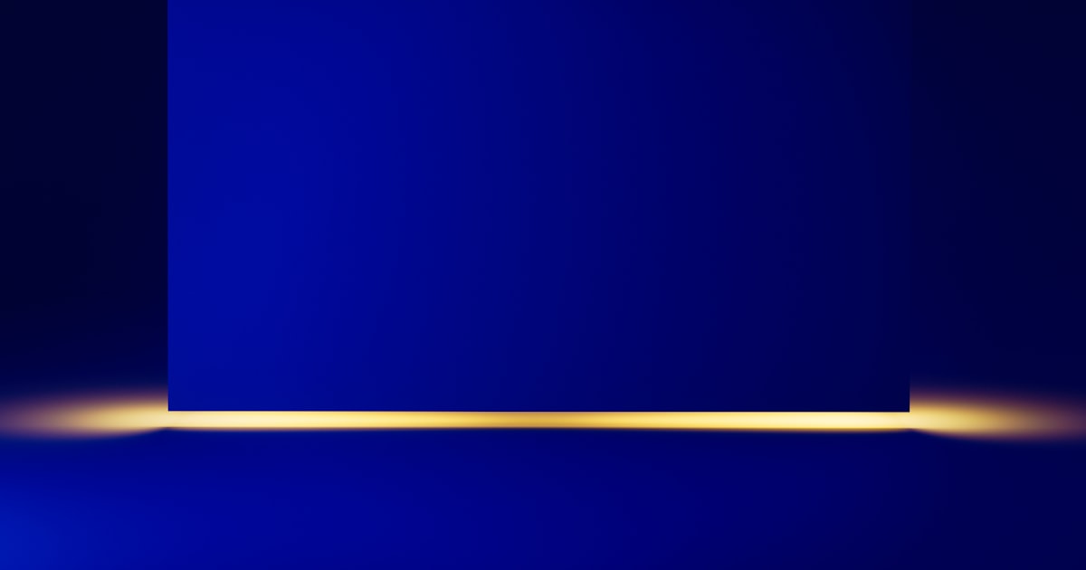 a blue wall with a yellow light coming from it