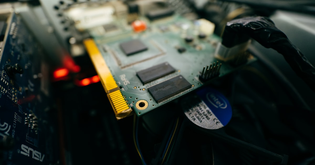 a close up of a computer motherboard with wires