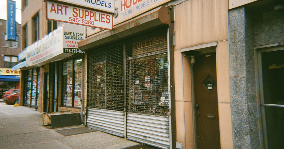An old hobby supply store is shown on the street.