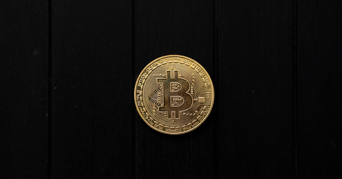 Bitcoin coin isolated on a black background.